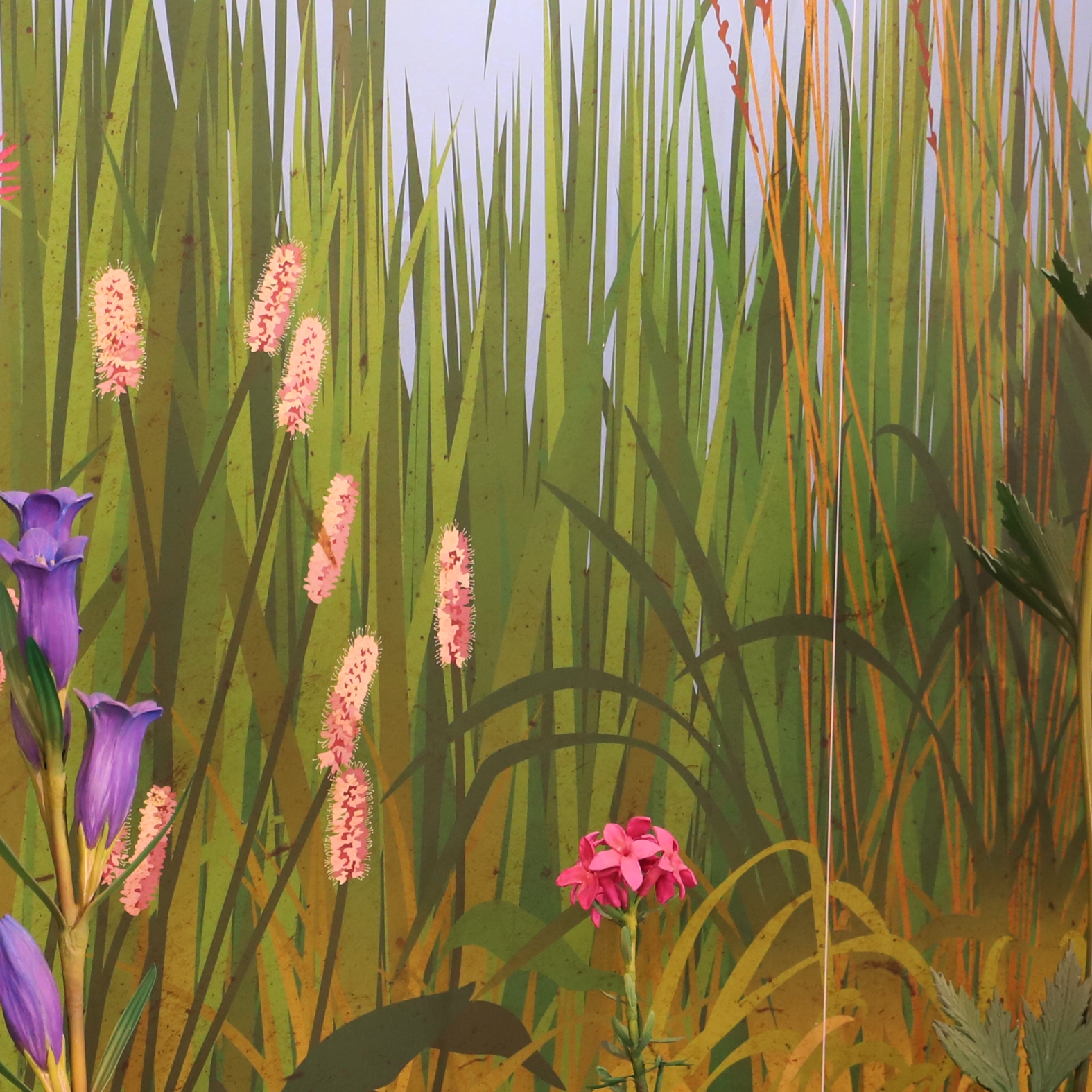 A gyep falgrafika részlete virágszobrokkal -2