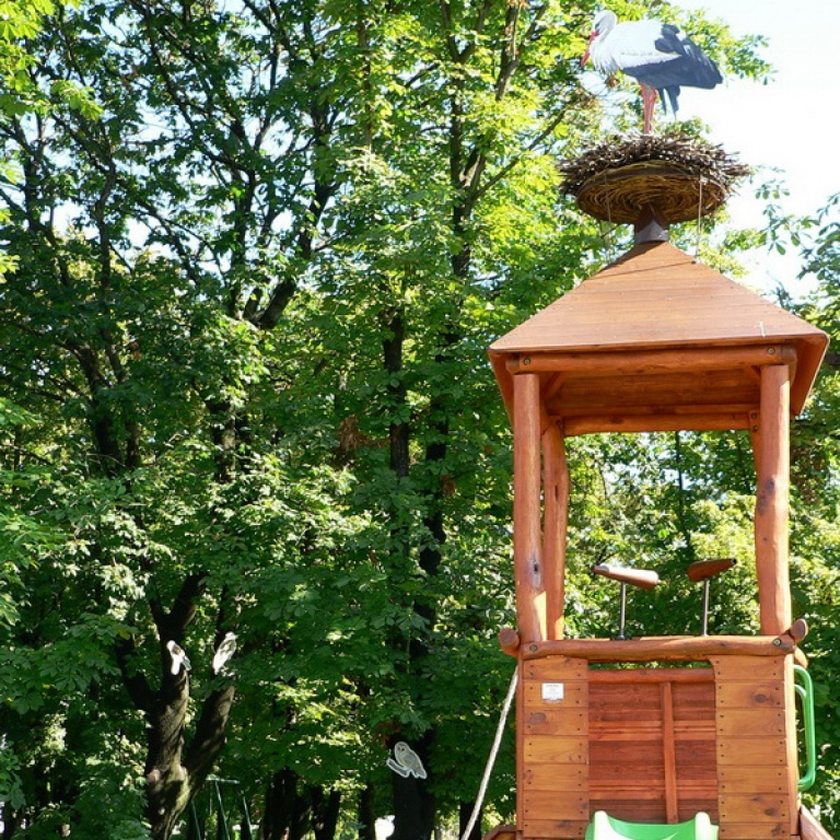 3 monoculars on a playground